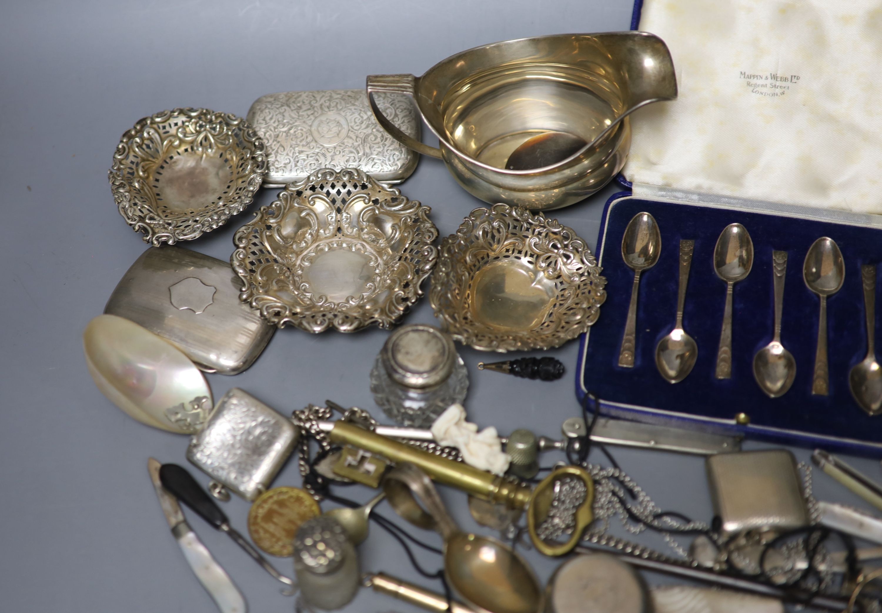 Mixed small silver and other collectable including a cased set of silver silver coffee spoons, a George III silver cream jug, bonbon dishes, cigarette cases, vesta case, flatware, scent bottles, a cold painted bronze bir